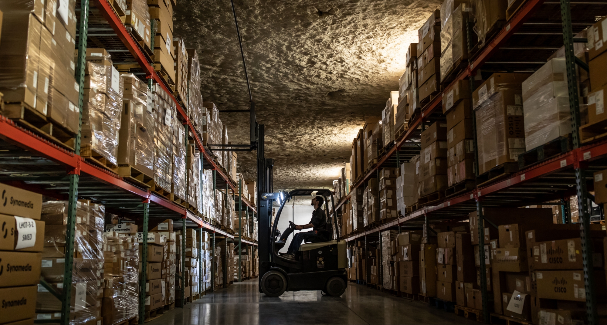 Man operating forklift in warehouse 